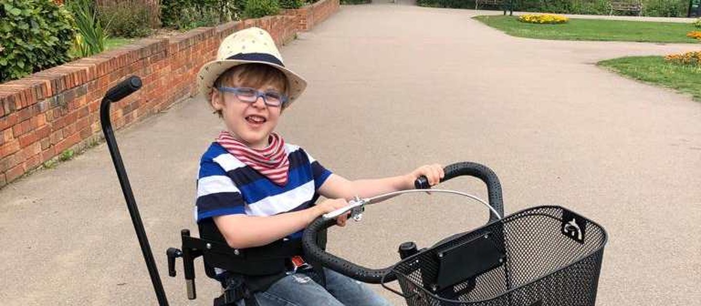 A child riding his very cool Whizz Kidz trike